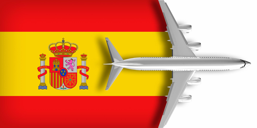 Dibujo de avión volando sobre la bandera de España